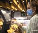 Buying food at supermarket during corona virus global pandemic.